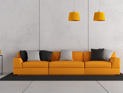 Modern living room with orange sofa and concrete wall - 3d rendering